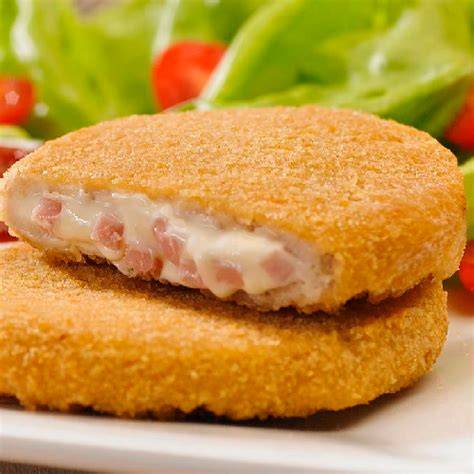 Medallón de merluza con jamón y queso
